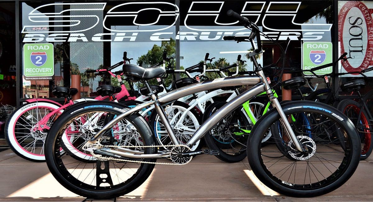 A group of SOULFAST EBIKES parked in front of a shop.