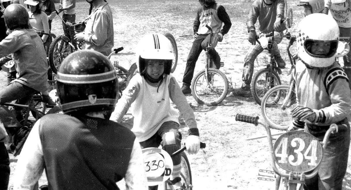 A group of people riding SOULFAST EBIKES in a dirt field.