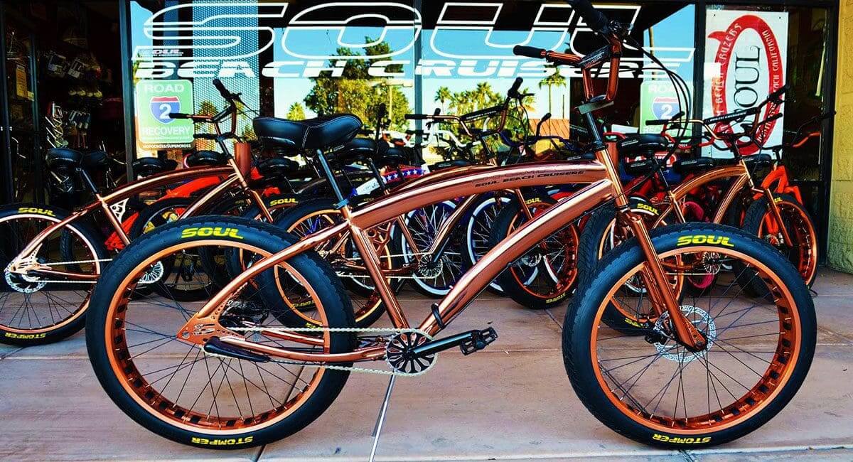 A Pedal Stomper bike parked in front of a store.