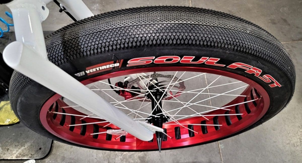 A motorcycle tire with a red and white rim from SOULFAST EBIKES.