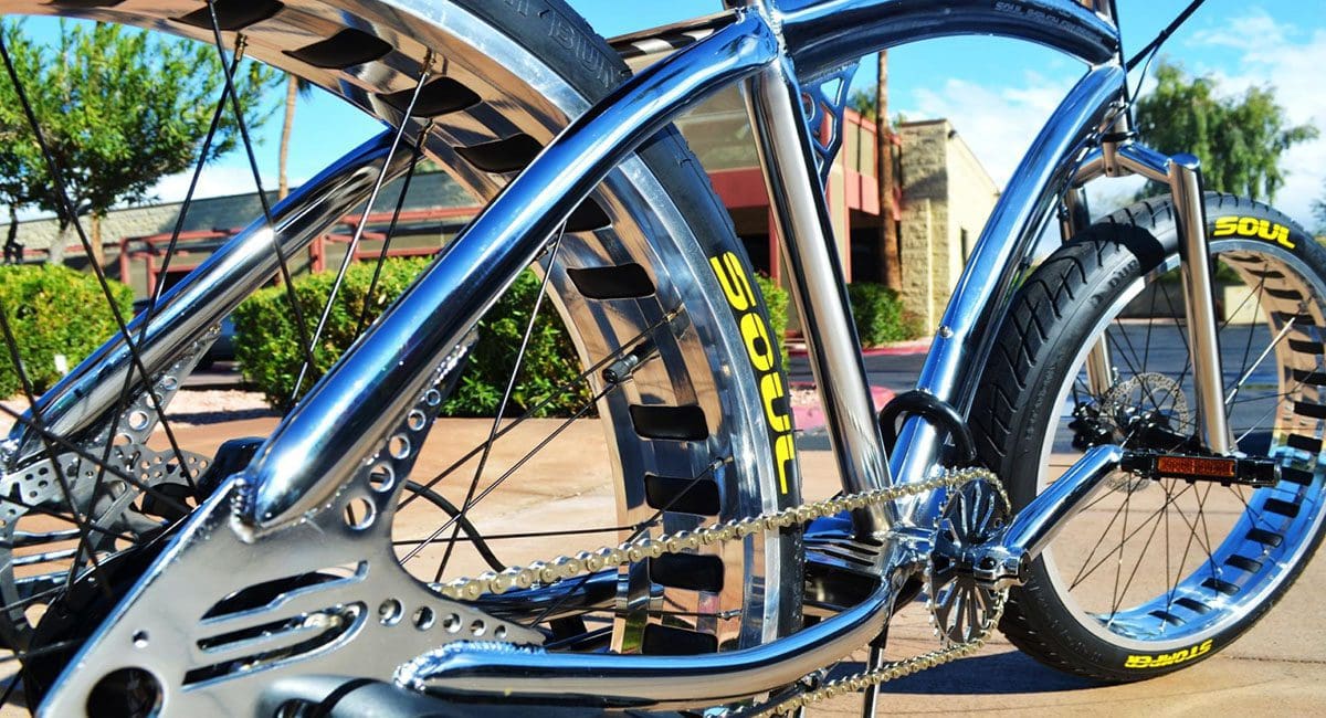 A Pedal Stomper bicycle is parked in front of a building.