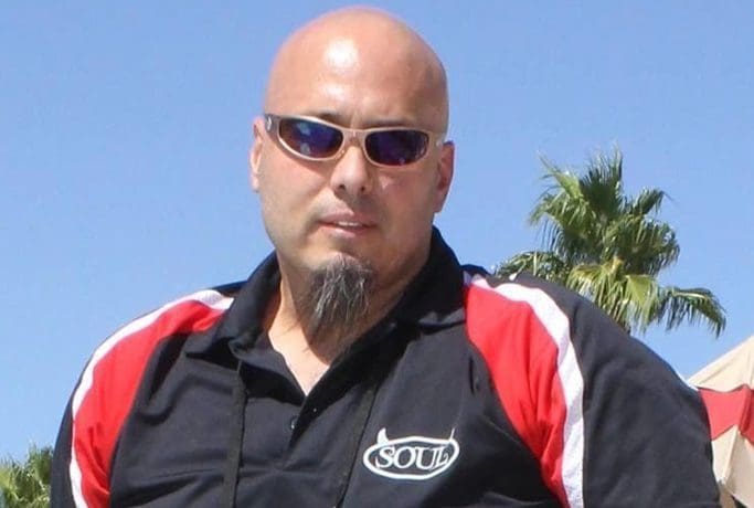 About SOULFAST EBIKES, a bald man wearing sunglasses and a polo shirt confidently showcases their stylish electric bikes.