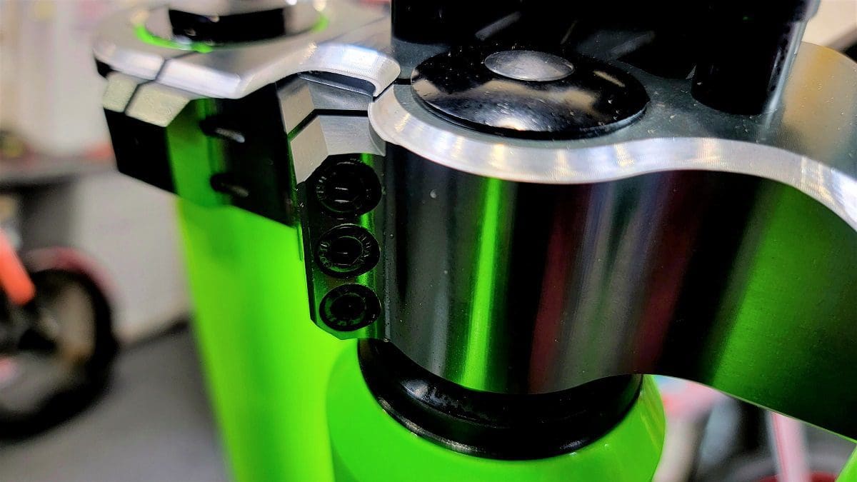 A close up of the top part of a coffee maker.