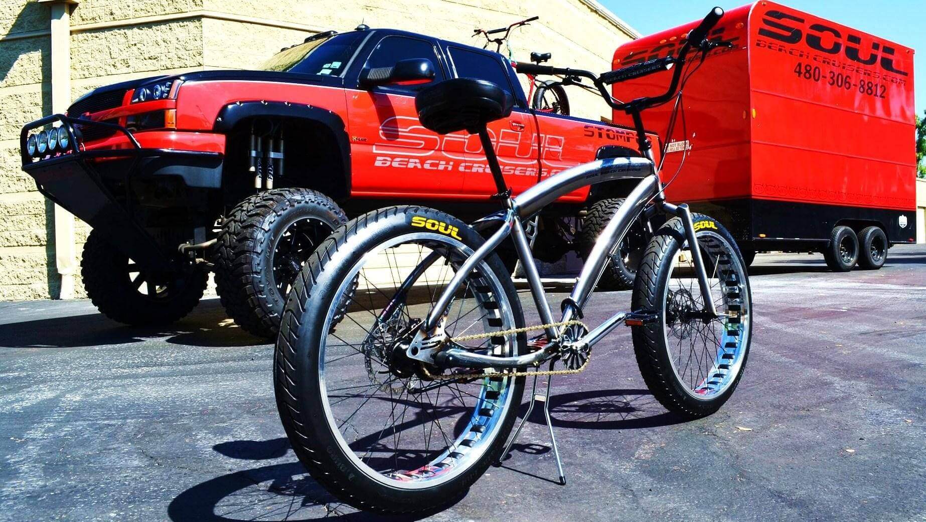 A Soul Stomper - Raw Polish parked in front of a truck.