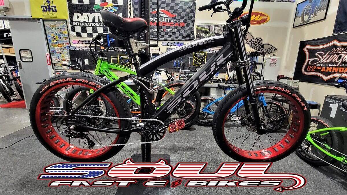 Black and red bike displayed at event.