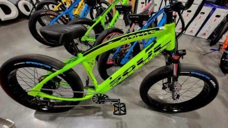 A group of bikes are parked in a room.