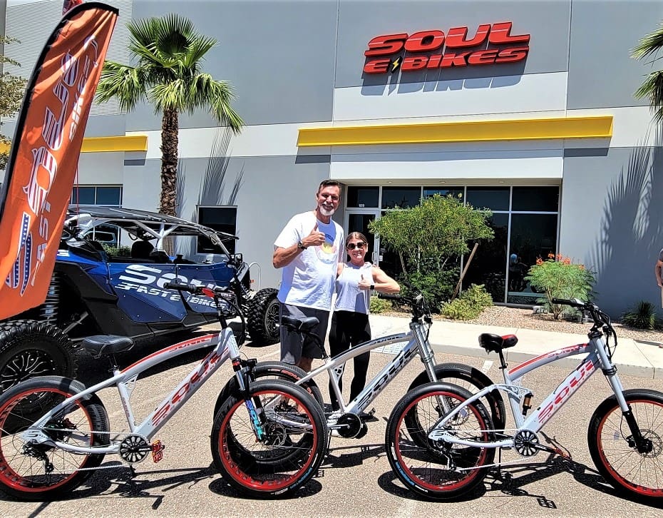 People with bikes outside Soul eBikes store.