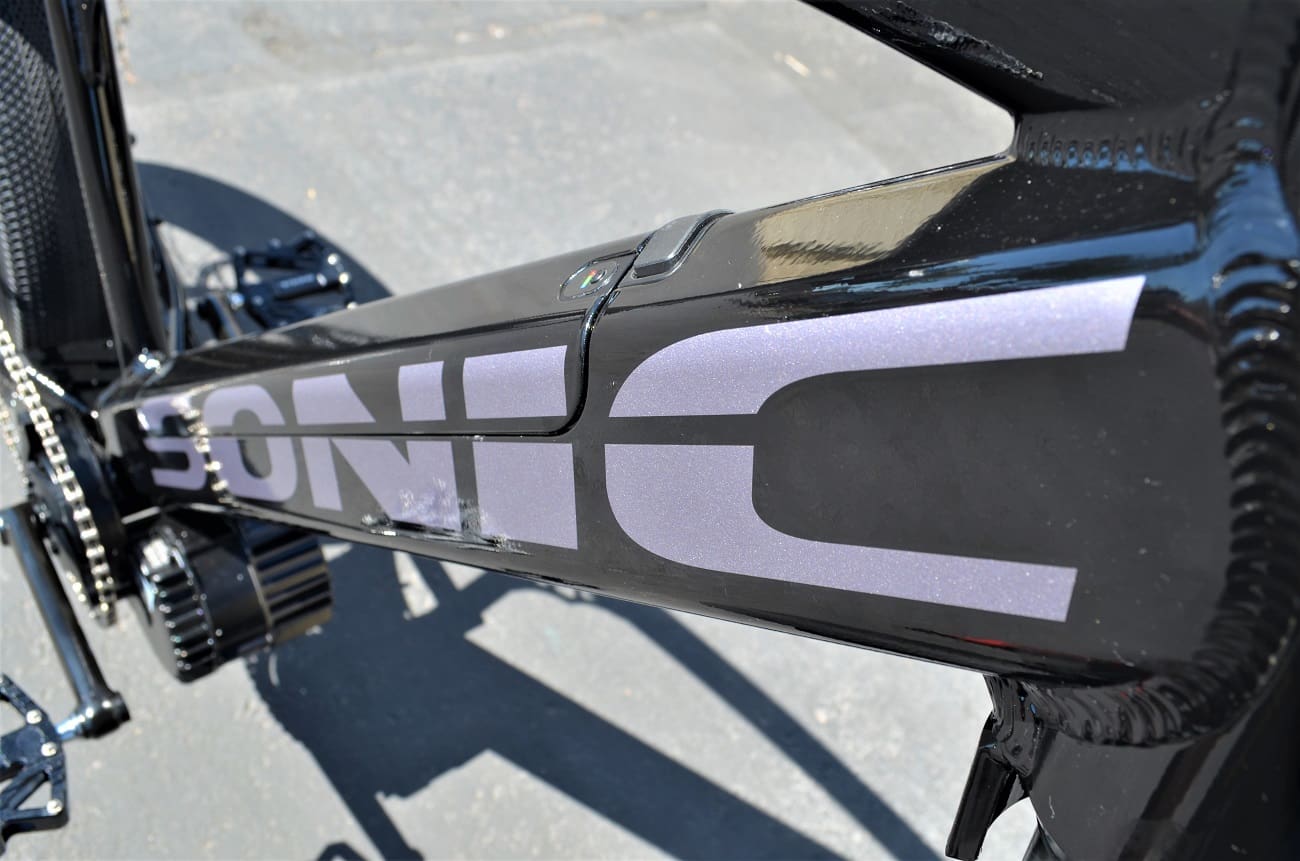 Bicycle frame with "SONIC" logo, close-up.