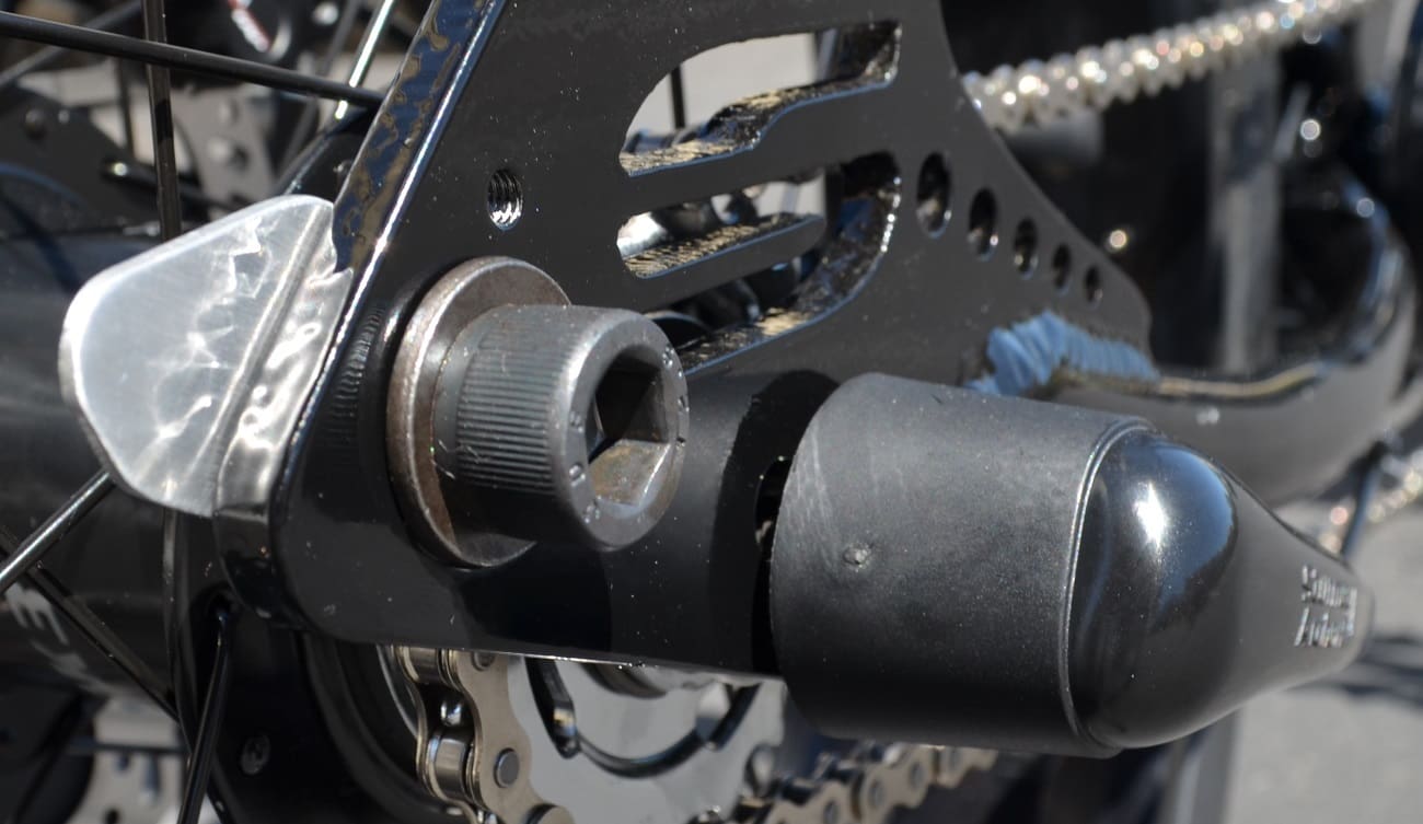 Bicycle axle and sprocket close-up view.