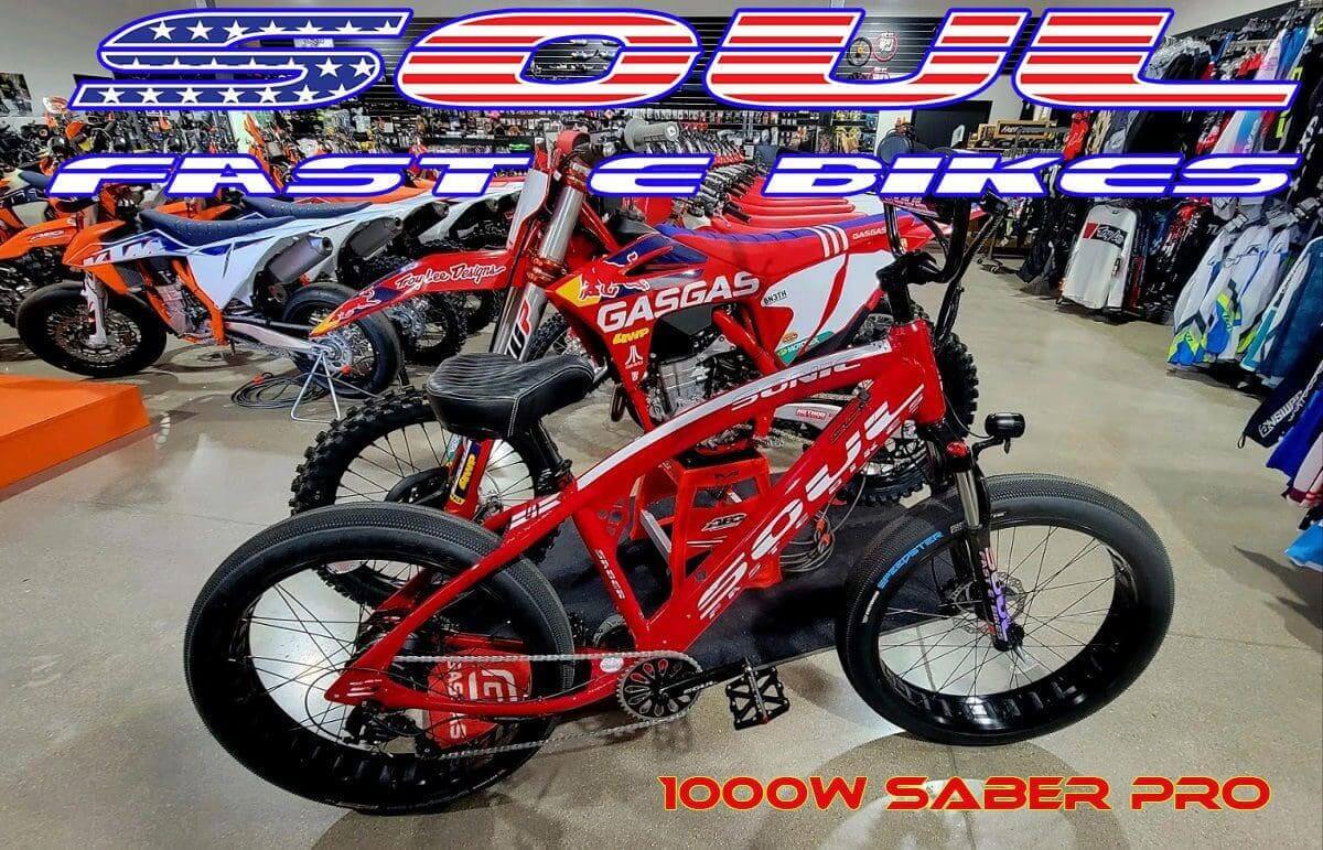 A group of motorcycles are parked in a room.