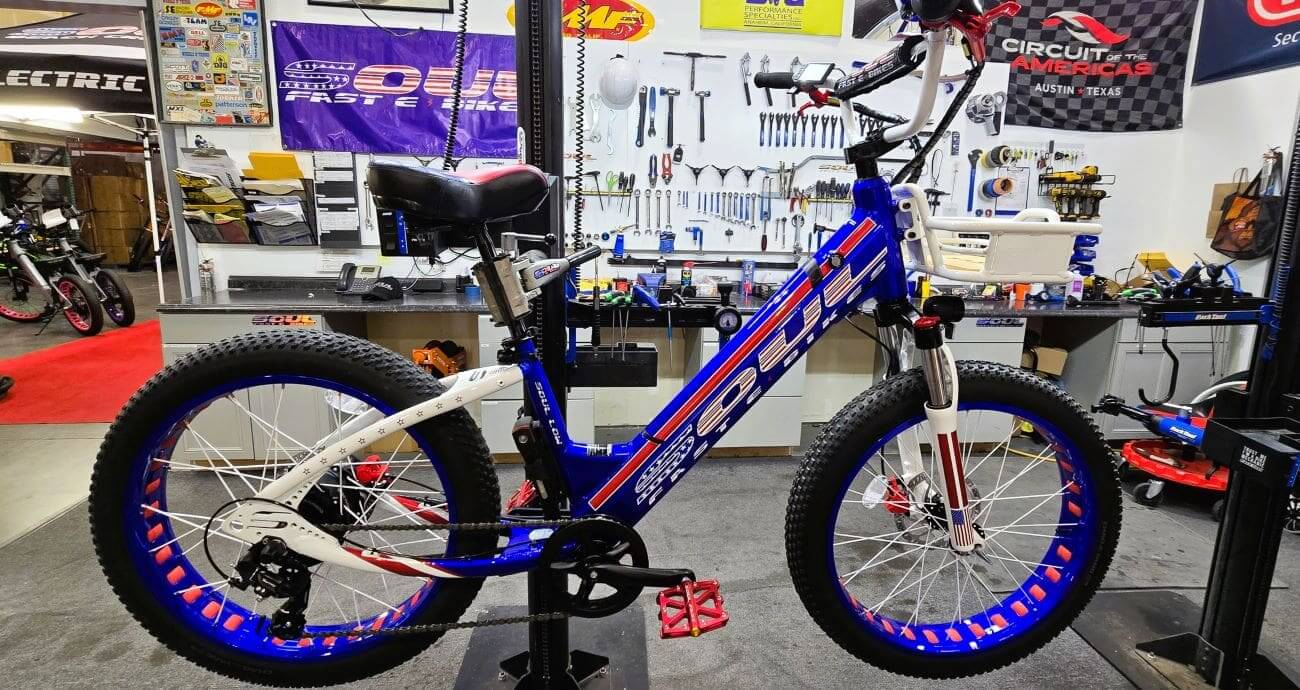 Electric bike in a workshop setting.