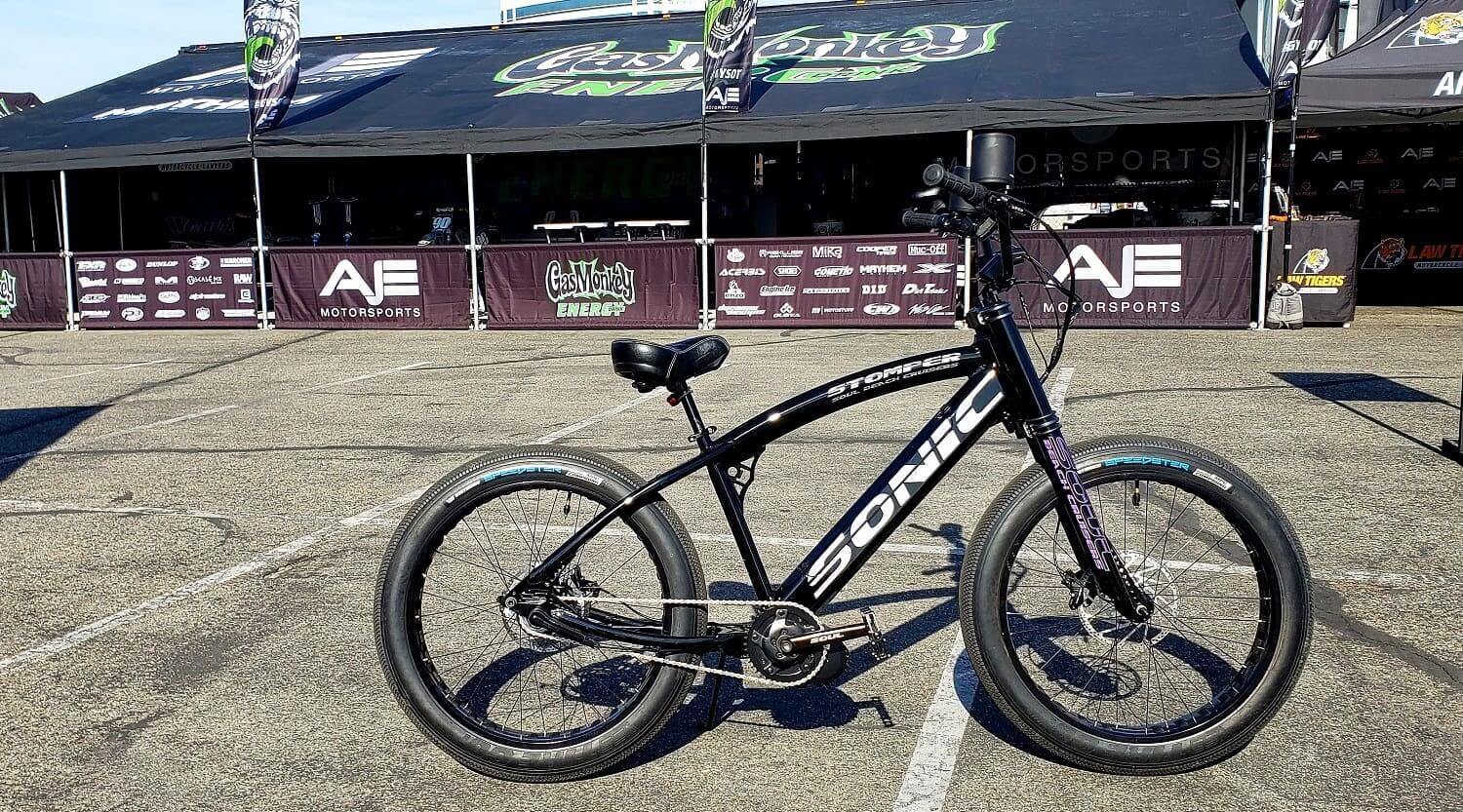 Electric bike displayed at outdoor event.