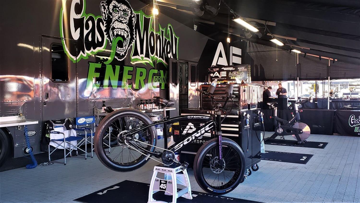 Bicycle workshop with Gas Monkey Energy branding.