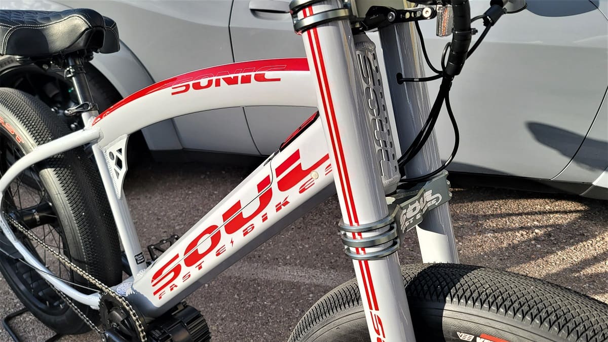 Close-up of a white electric bicycle.