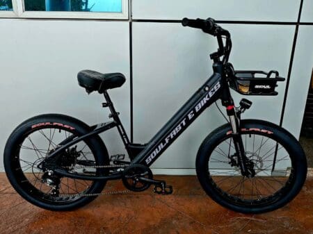 Black electric bike with thick tires.