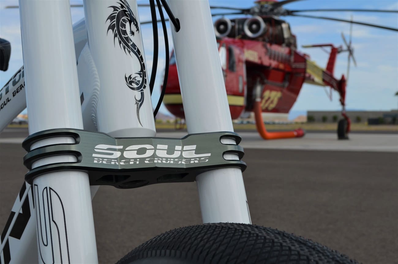 Bicycle frame with helicopter in background.