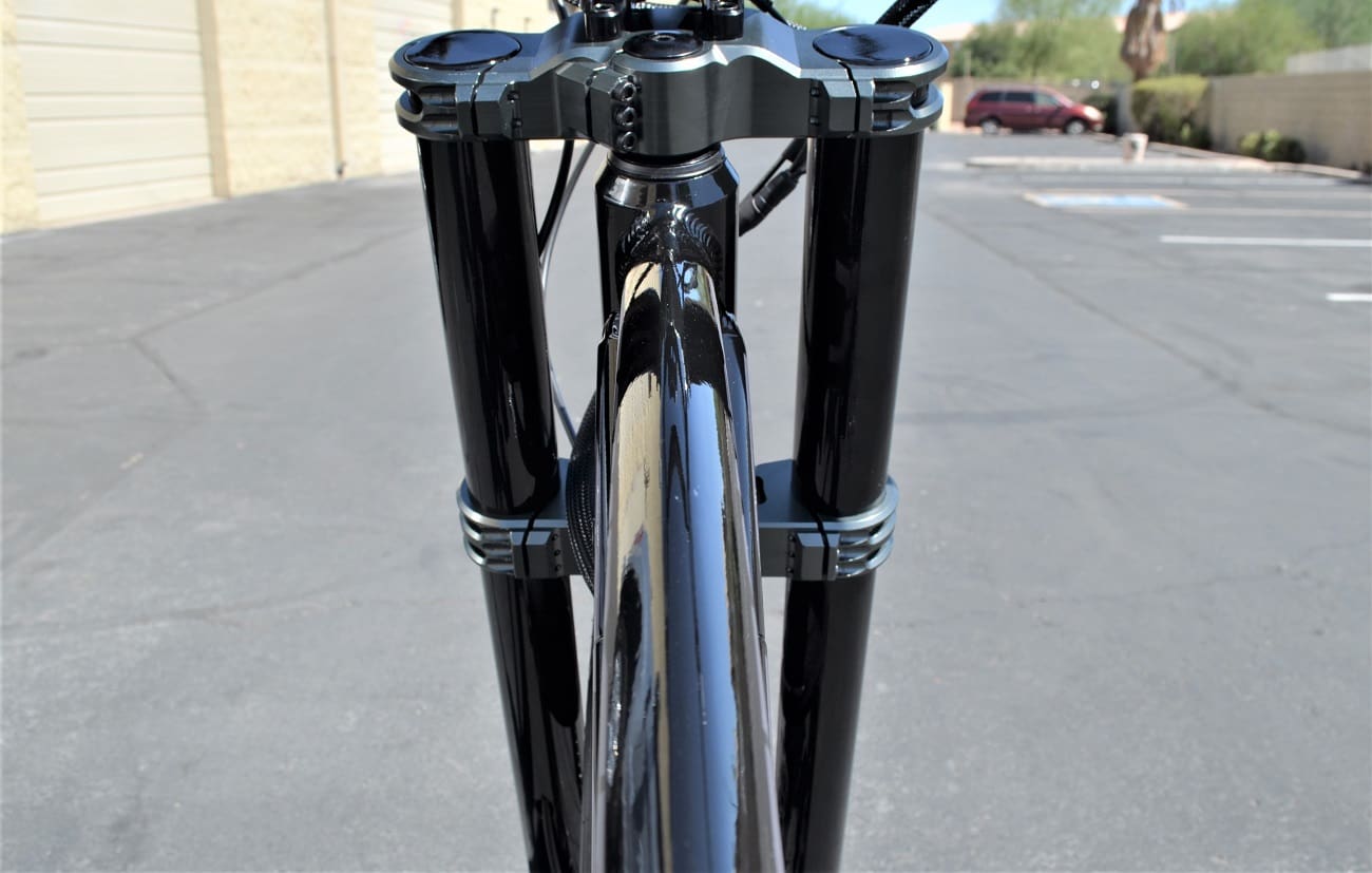 Close-up of bicycle front suspension fork.