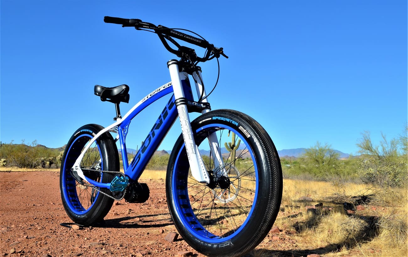 Blue mountain bike on a desert trail.