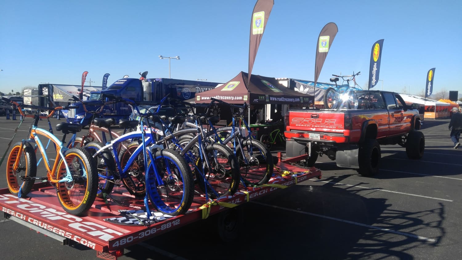 Truck transporting bicycles on a trailer.