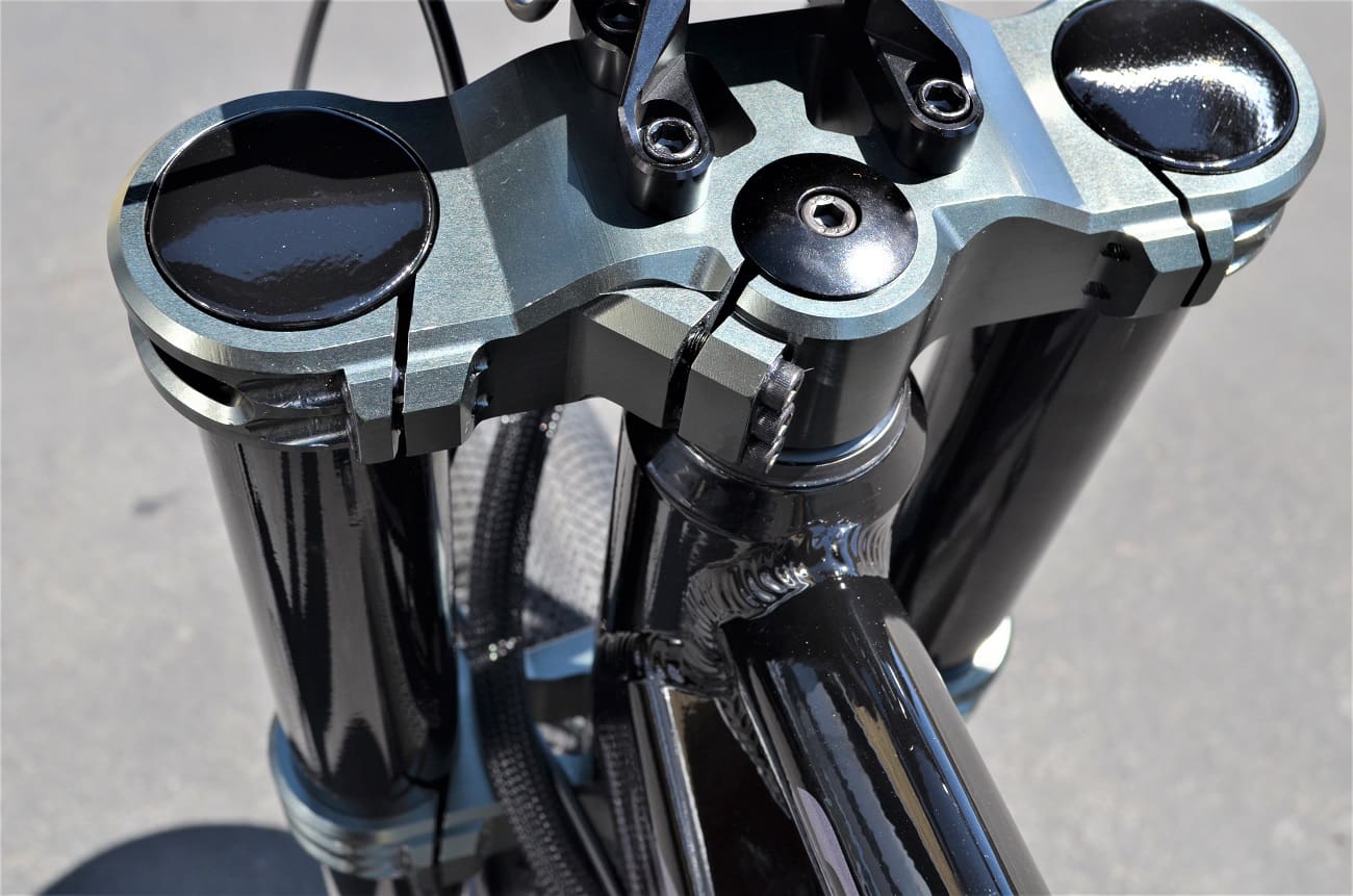 Motorcycle front fork suspension close-up.