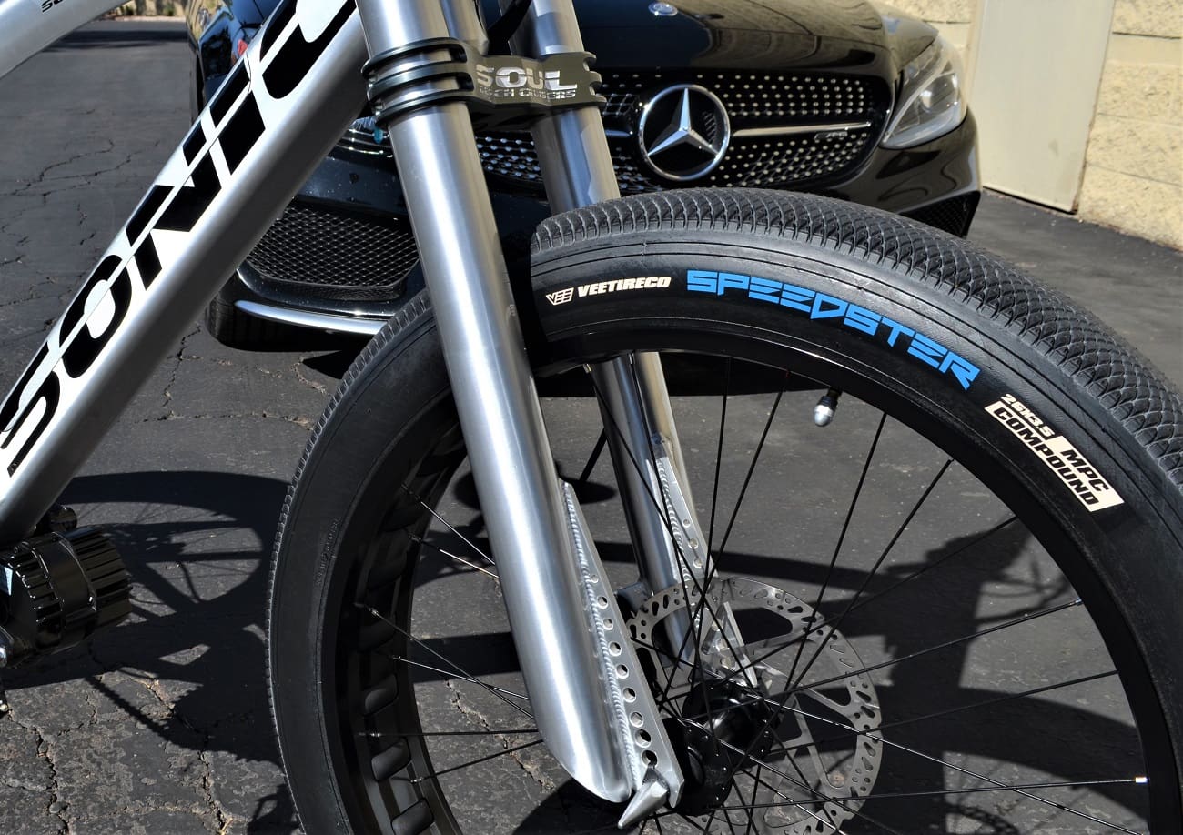 Bicycle wheel and Mercedes-Benz front view.
