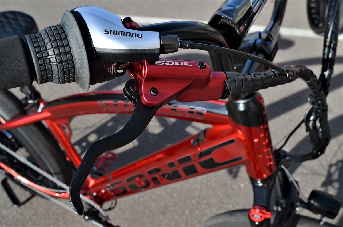 Red bicycle with Shimano gear shifter.