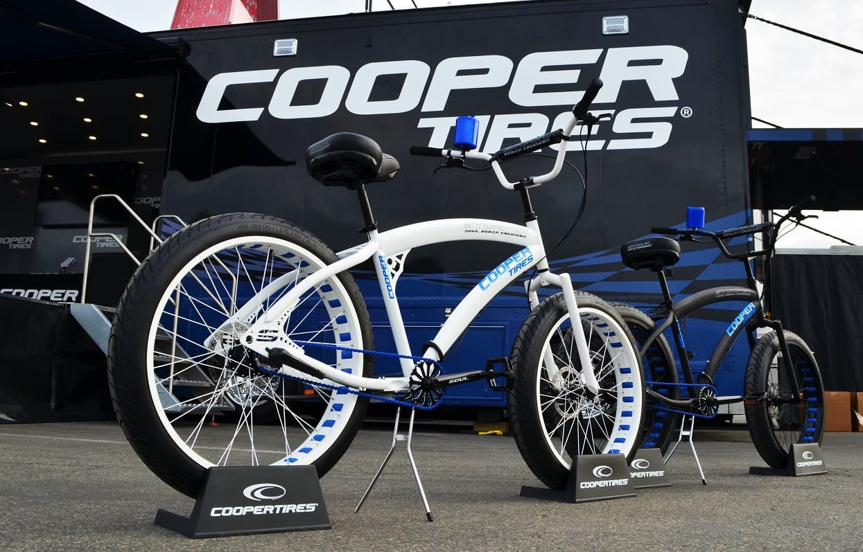 Two bicycles displayed in front of trailer.
