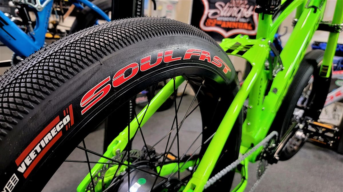 Green bicycle with "Soul Fast" tire branding.