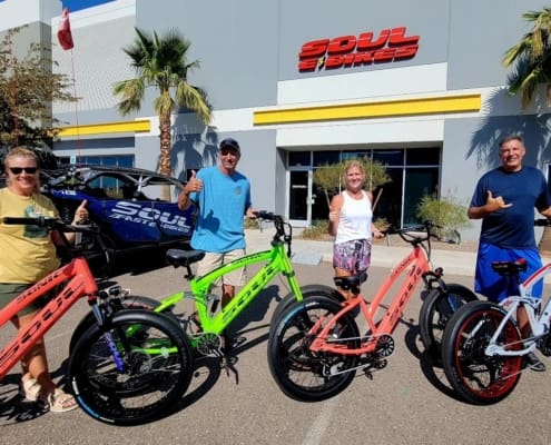 Group with colorful bikes outside Soul Bikes.