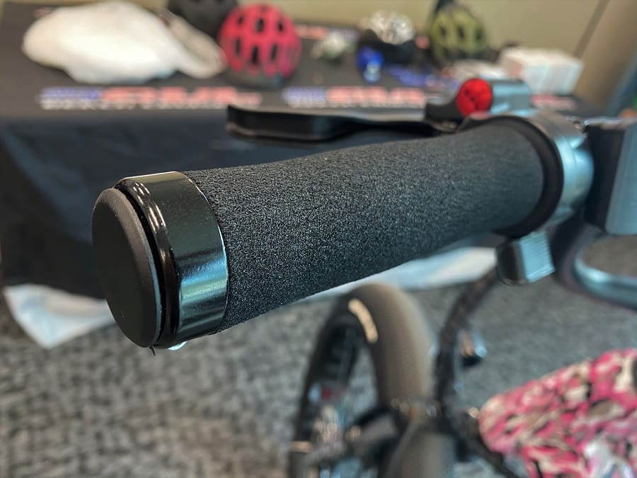 Bicycle handlebar grip with blurred background.
