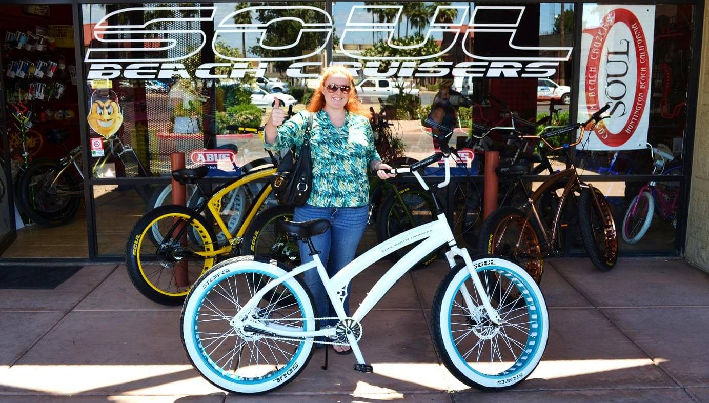 Woman with a custom beach cruiser bike.
