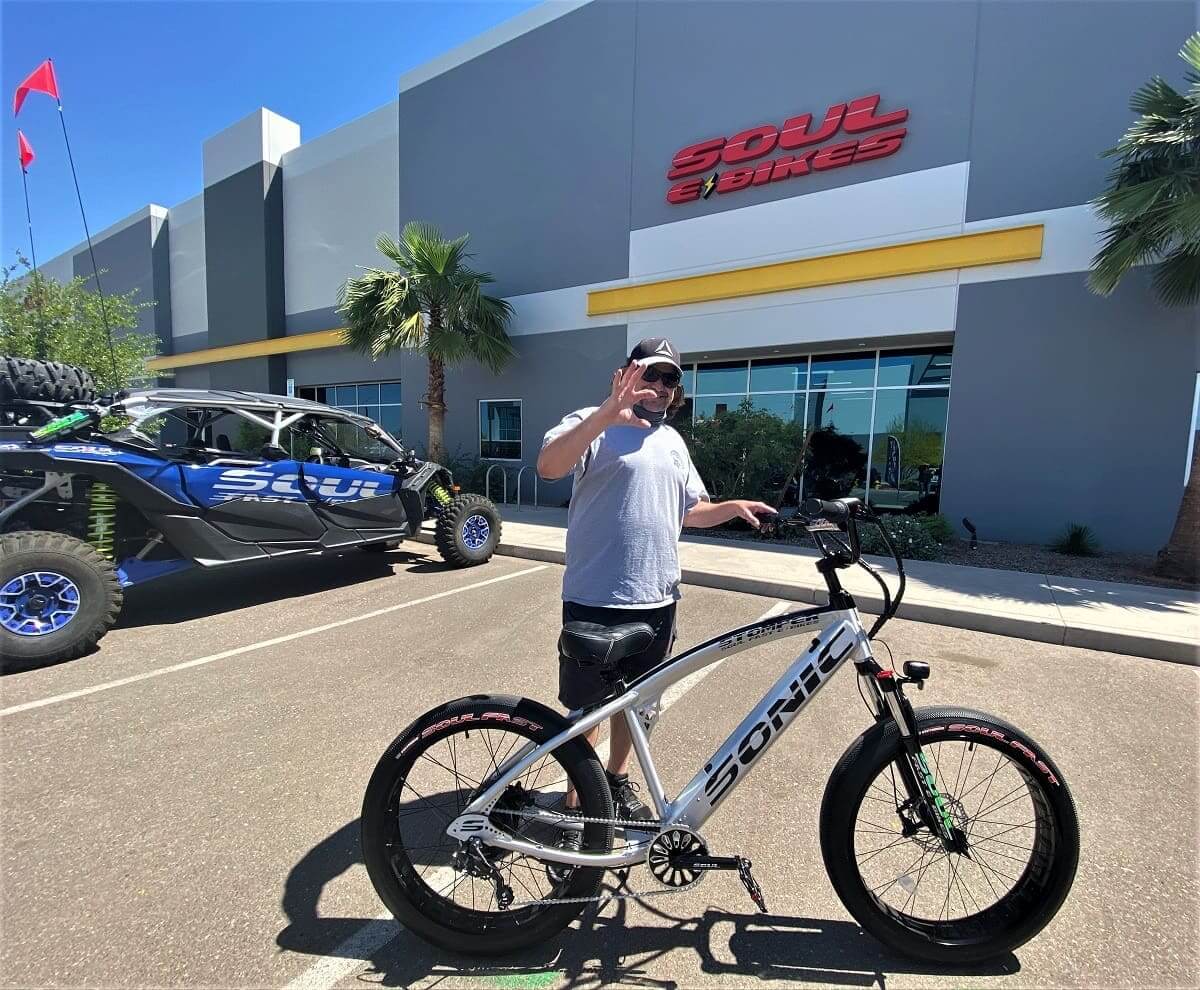 Man posing with bike outside Soul Bikes.