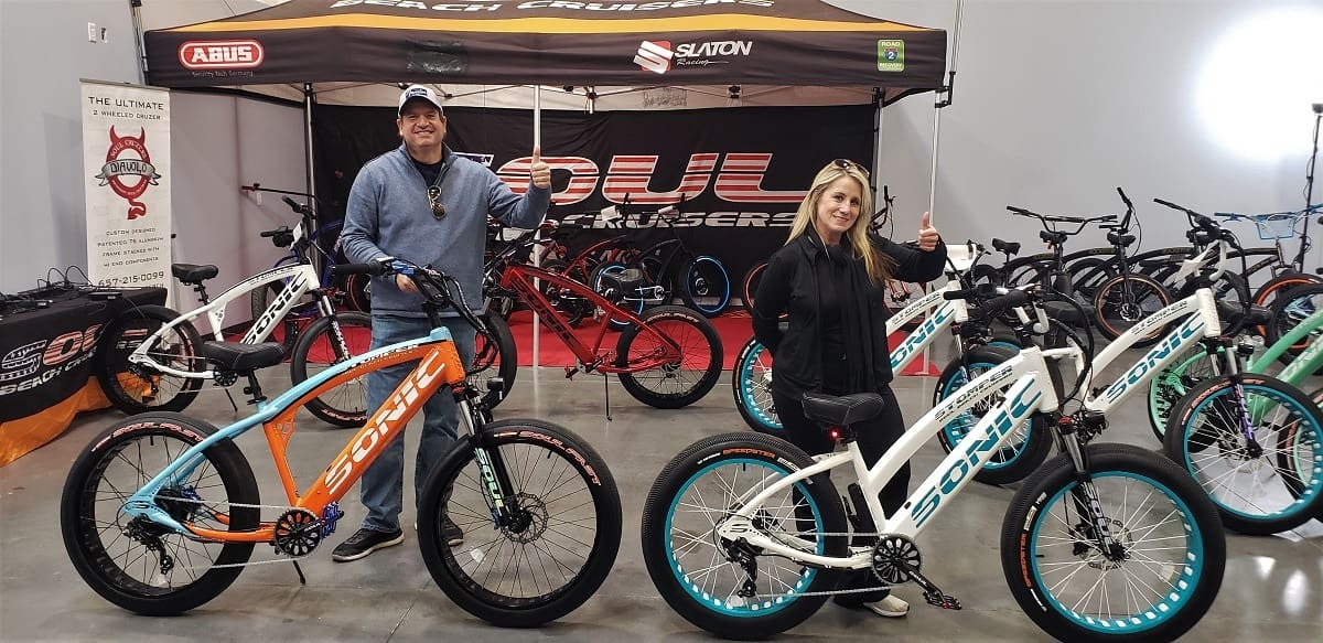 Two people showcasing Soul electric bikes.
