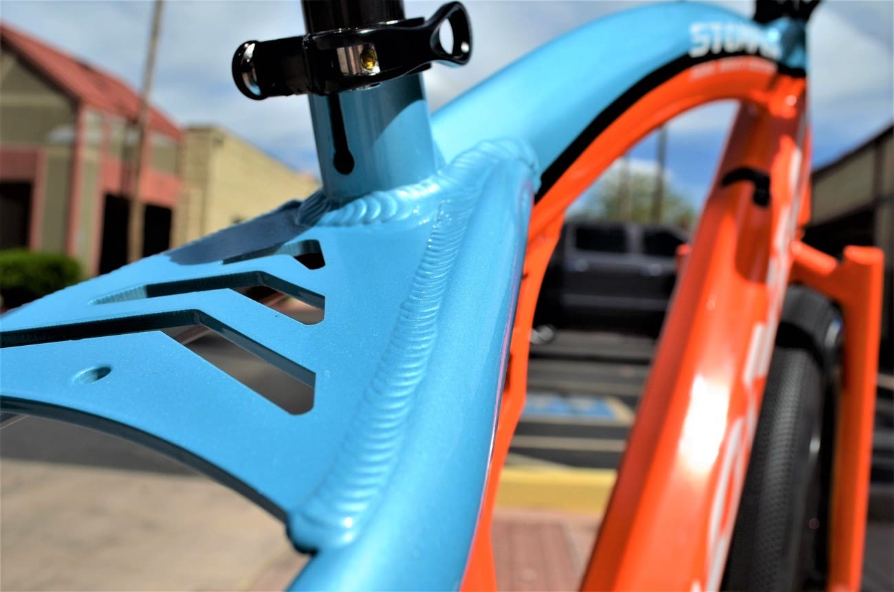 Close-up of a colorful bicycle frame.