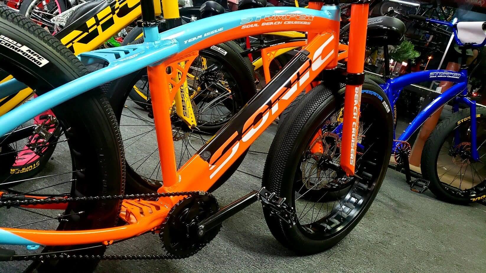 Colorful bicycles displayed in a showroom.