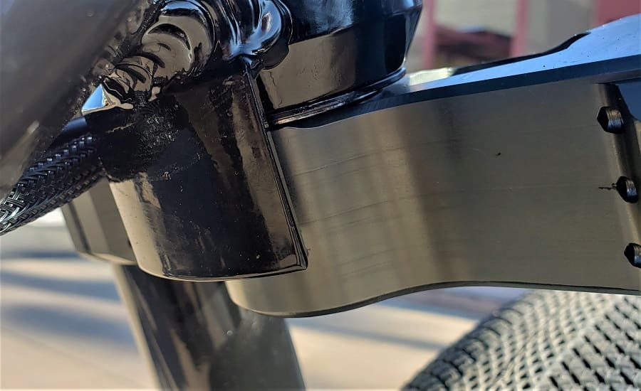 Bicycle frame with textured tire close-up.