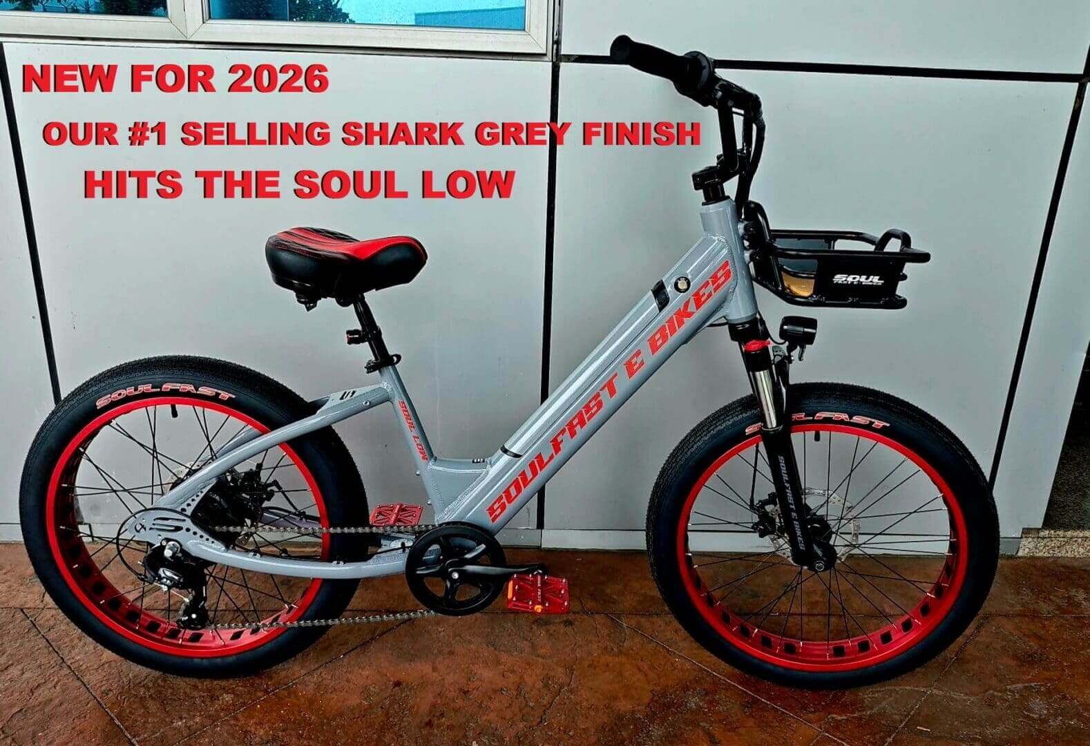 Grey bike with red accents, promotional text.