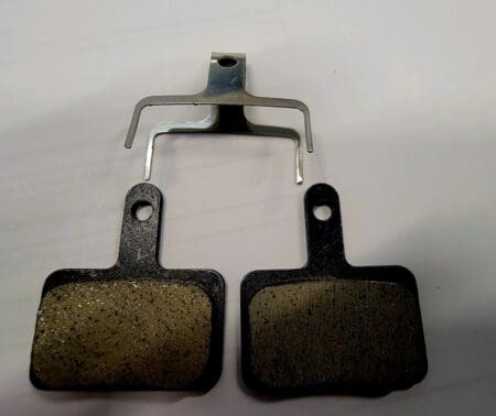 Bicycle disc brake pads and spring.