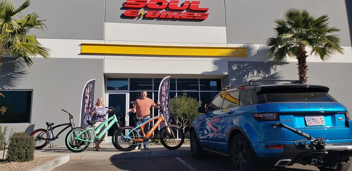 People with bikes outside Soul Bikes shop.