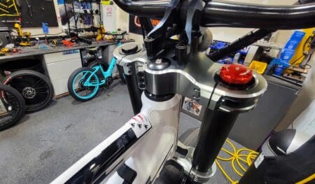 Mountain bike handlebars in a workshop.