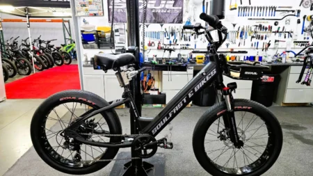 Electric bike in a workshop setting.