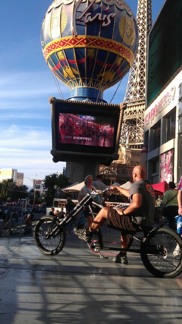 Man cycling near Paris Las Vegas Hotel.