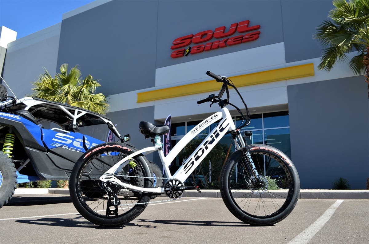 Electric bike in front of store entrance.