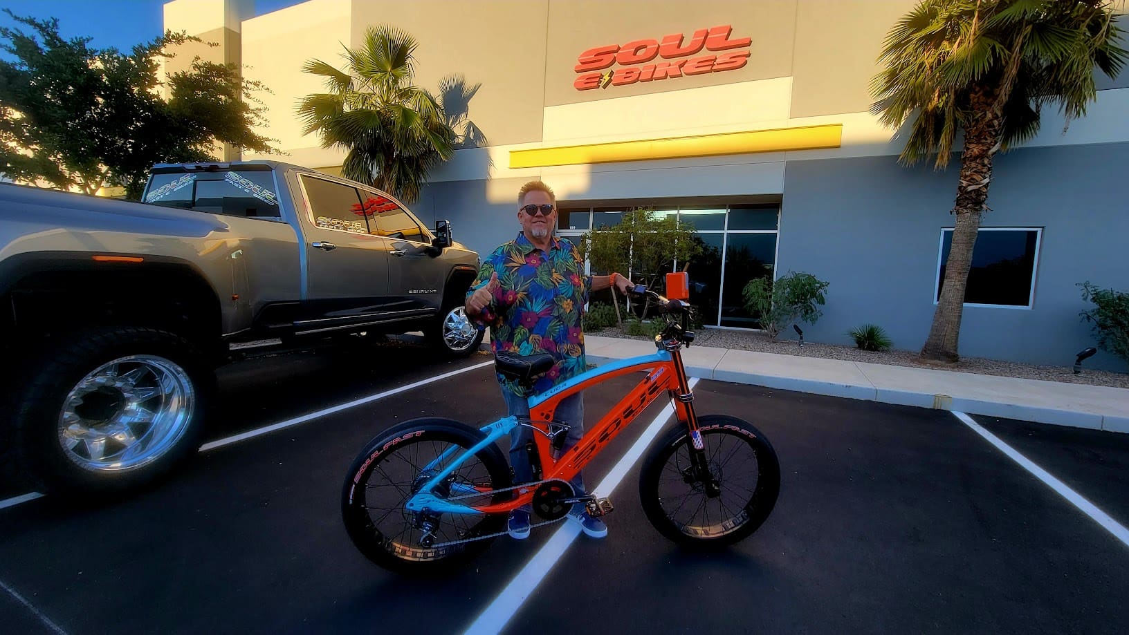 Person with colorful bike outside Soul Bikes.