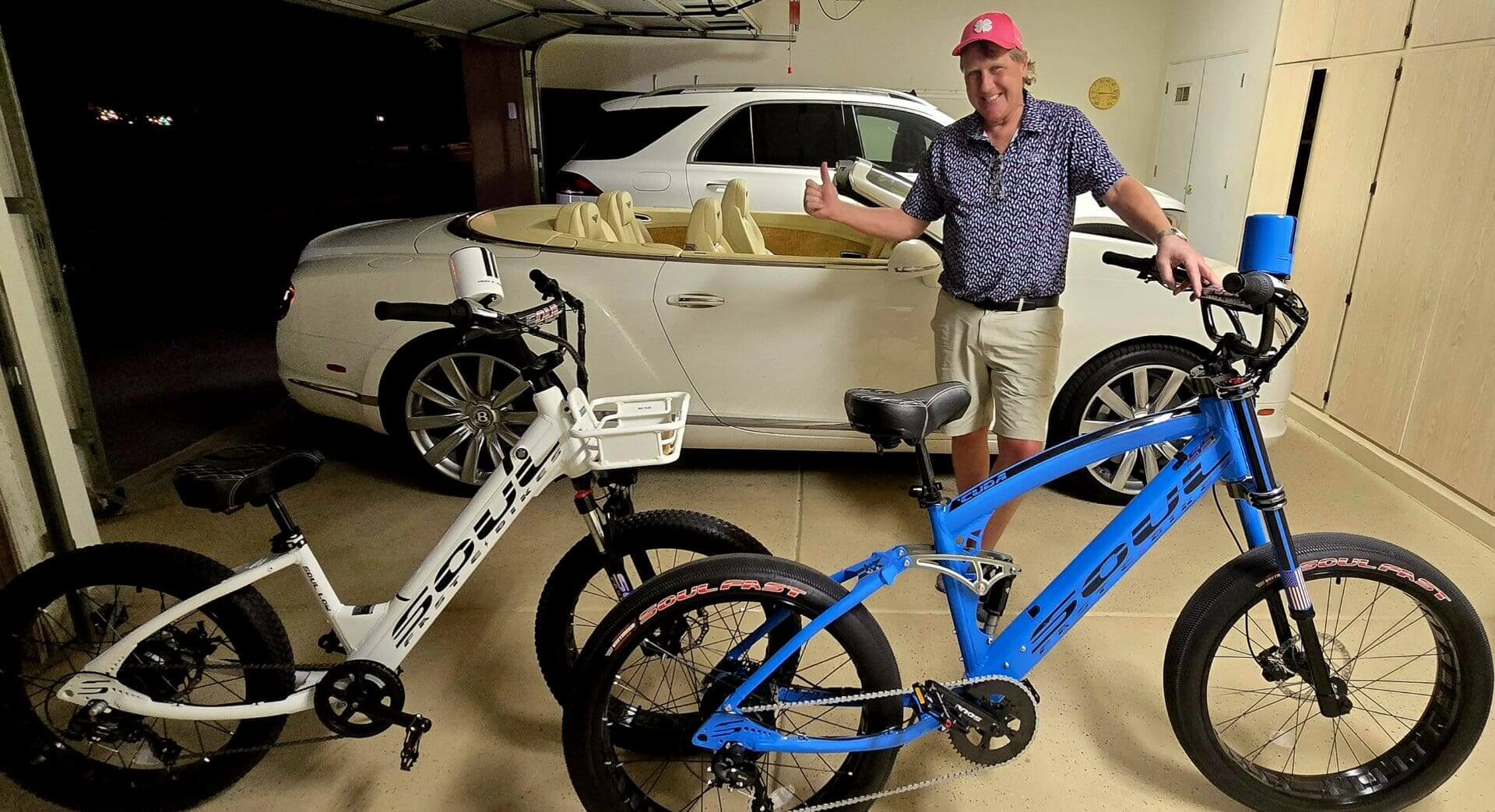 Man with two bikes and a car.
