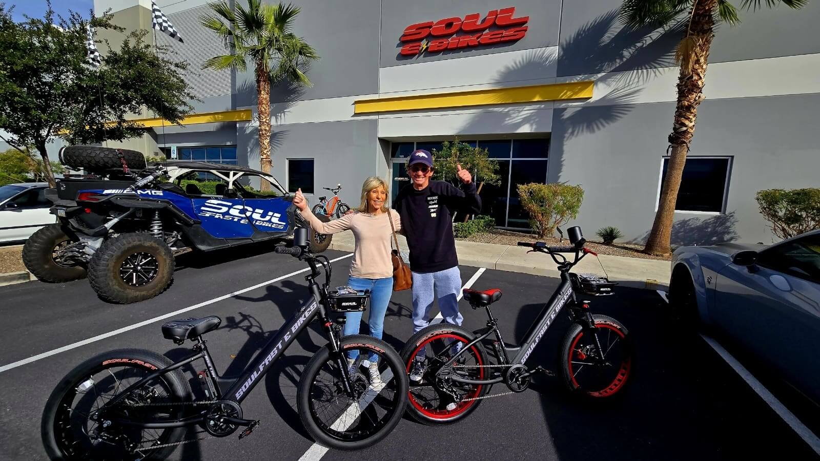 Couple with electric bikes outside Soul building.