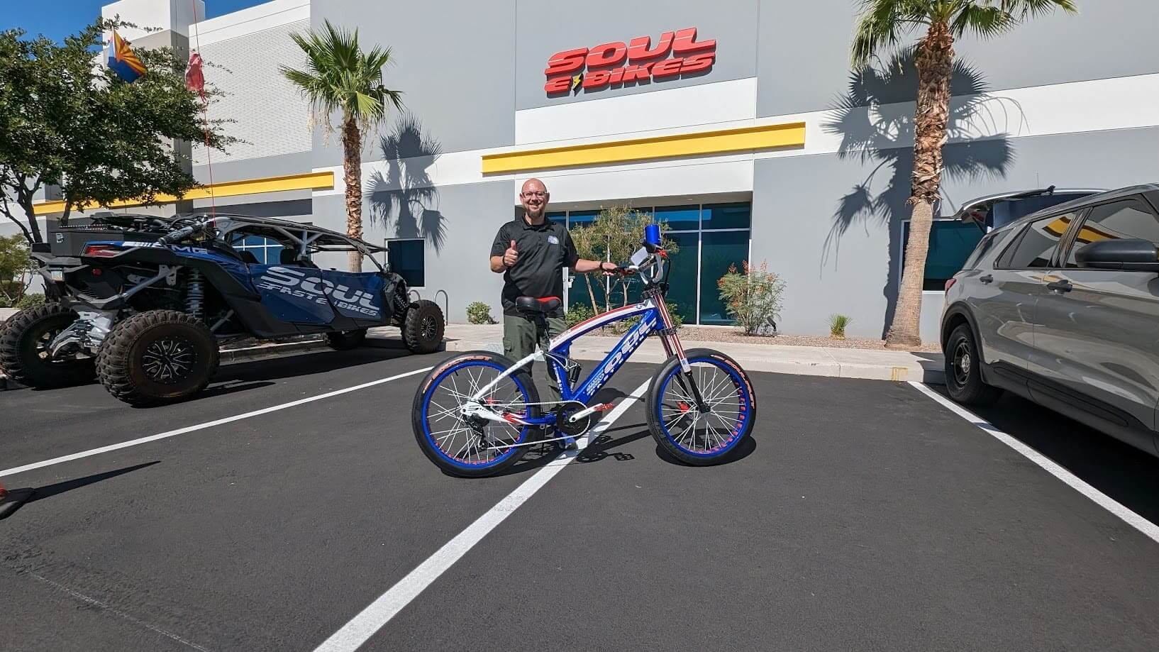 Man with bike outside Soul Bikes building.
