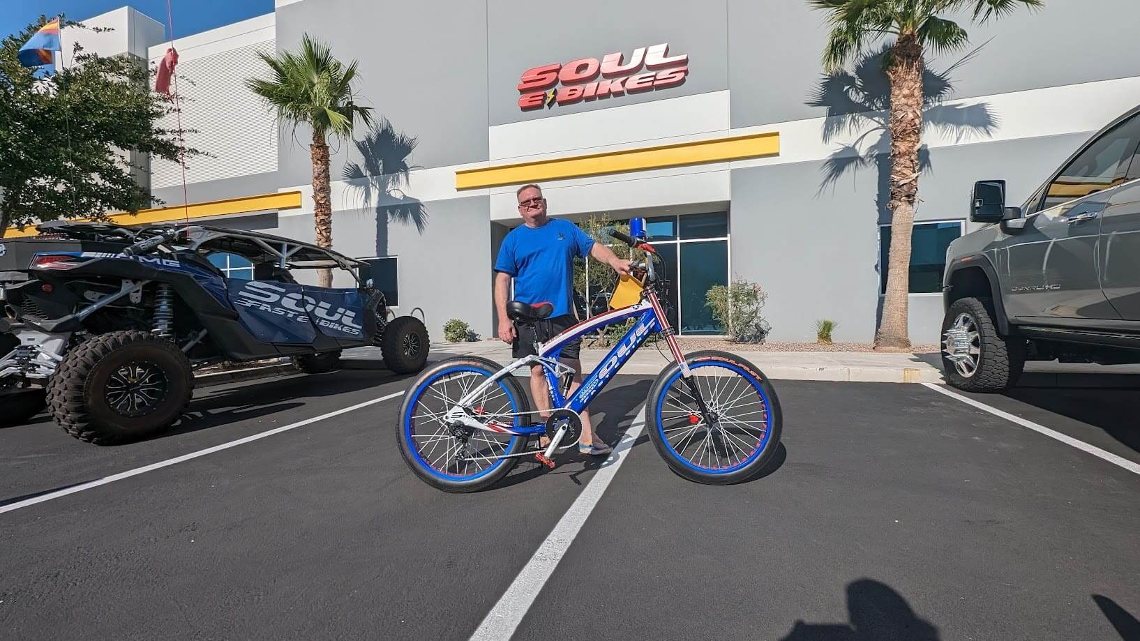 Man posing with bicycle outside Soul Bikes.