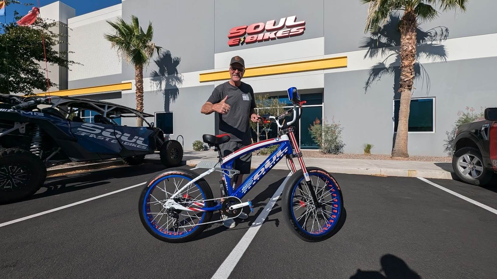 Man posing with bike outside Soul Bikes.