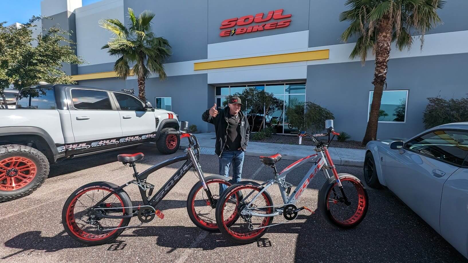 Man with bikes outside Soul Bikes store.